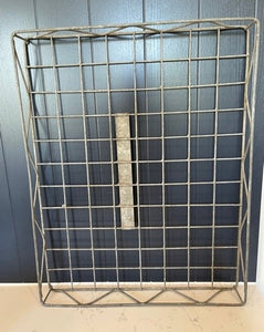 A galvanised metal wire bakers tray