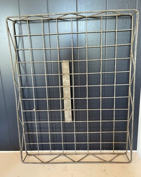 A galvanised metal wire bakers tray